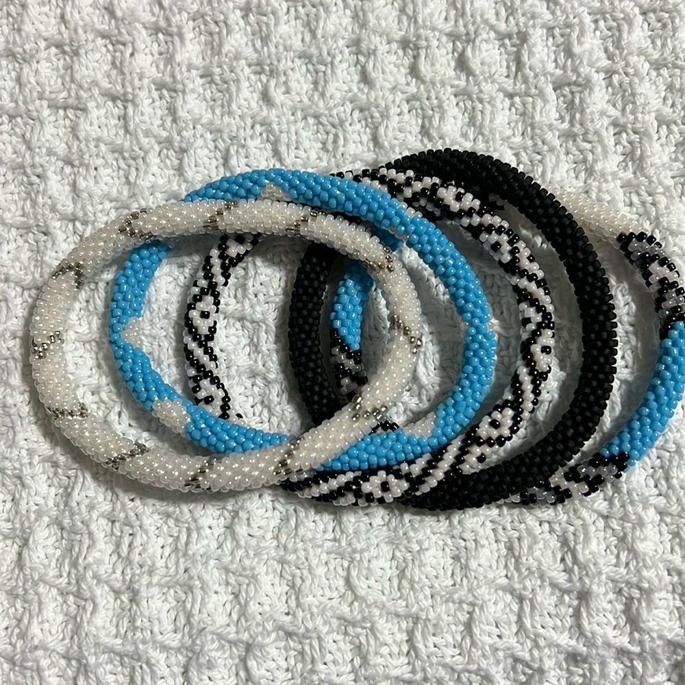 5 Sashka Co handcrafted beaded bracelets. Light blue, black, white. Approx 8”.